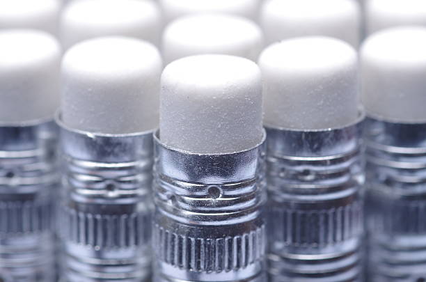 Close up Various Unused White Pencil Erasers on Aluminum Shells
