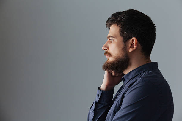 istock Side view portrait of a pensive man 520844606
