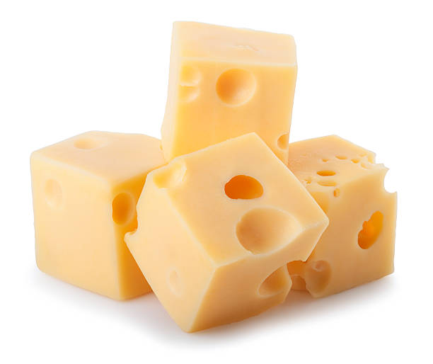 ビットのチーズに隔てられた白の背景 - swiss cheese ストックフォトと画像