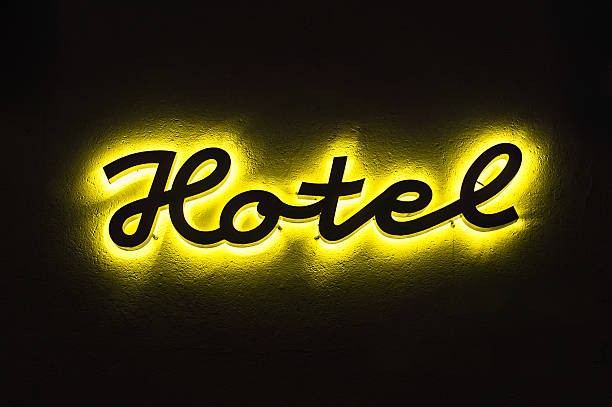 istock Illuminated hotel sign on the building 520845948