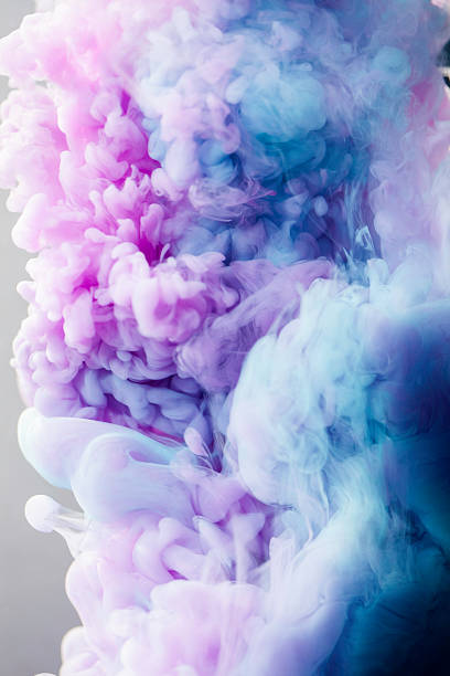 istock Pink and blue ink in water 520859417