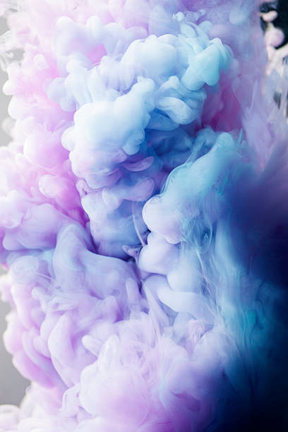 istock Pink and blue ink in water 520859421
