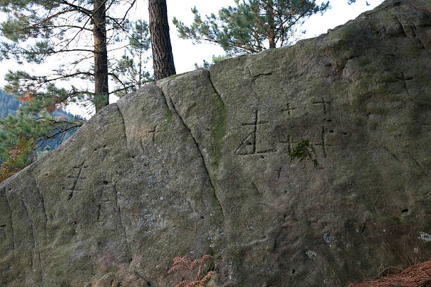 istock Ancient symbols in the rock 520860235