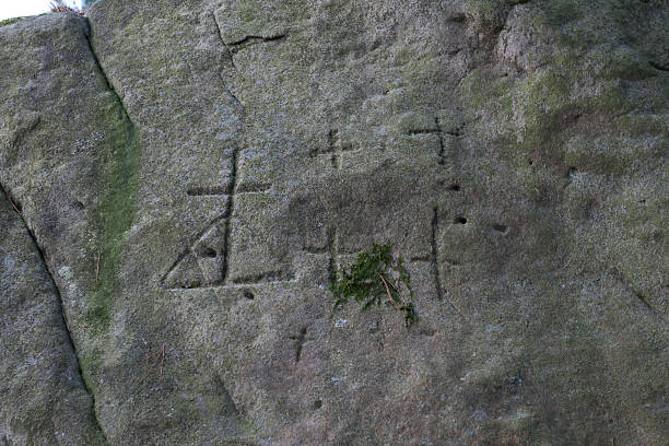 istock Ancient symbols in the rock 520860237