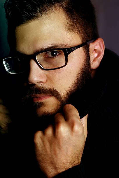 istock young man with a mysterious look 520861617