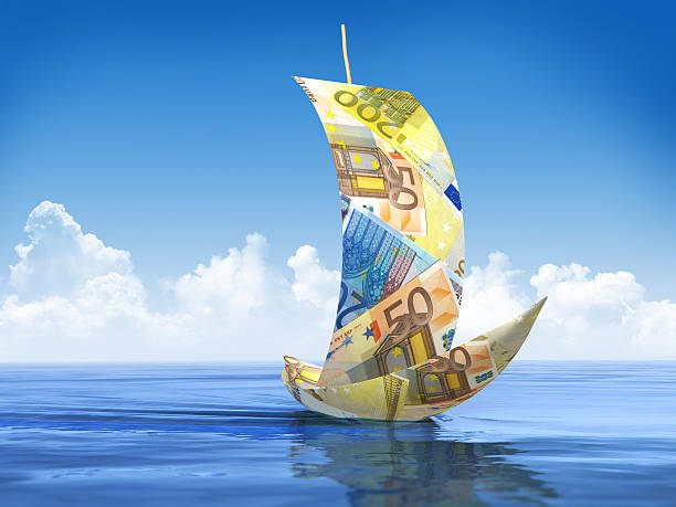 Yellow paper boat with trace on blue background