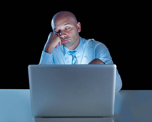 istock stressed businessman working on computer laptop late 520862851
