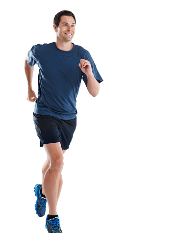 Studio shot of a handsome young athlete running against a white background
