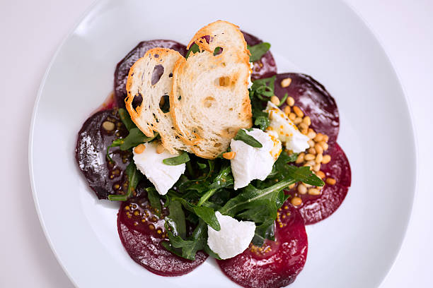 Salad with a slice of boiled beet stock photo