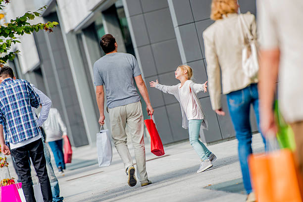 istock Father and Daughter Walking on  Sidewalk After Shopping 520863443