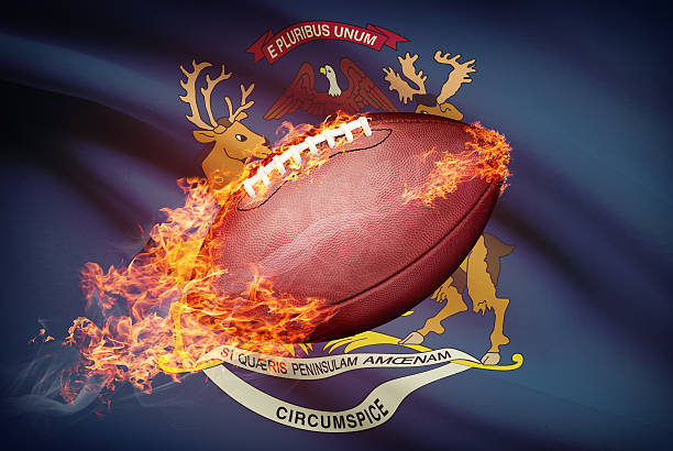 American football ball with flag on backround series - Michigan American football ball with flag on backround series - Michigan michigan football stock pictures, royalty-free photos & images