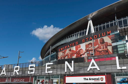 London, UK - September 24, 2014 : Emirates Stadium, North London, home of English Premier League team Arsenal Football Club. View shows the south entrance and club shop.