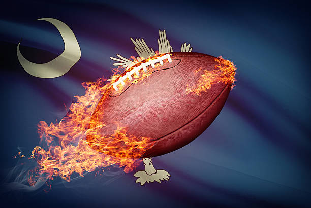 American football ball with flag - South Carolina American football ball with flag on backround series - South Carolina south carolina football stock pictures, royalty-free photos & images