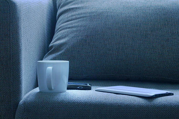 istock Bed-tablet pc cell phone and a cup of coffe 520865645