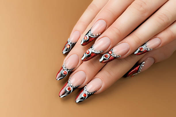 istock Female hand with manicure  and beautiful design on  nails. 520866435