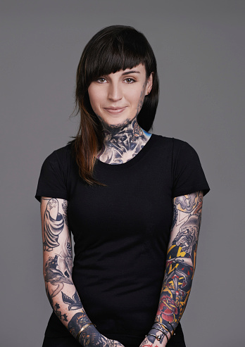 A cropped studio portrait of a beautiful tattooed young womanhttp://195.154.178.81/DATA/i_collage/pi/shoots/784105.jpg