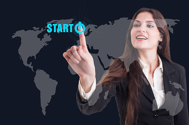 istock Business woman pressing start button on digital transparent scre 520875162