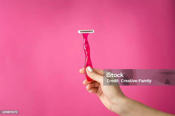 Red Shaver In Woman Hands Stock Photo - Download Image Now - Razor, Women, Shaving