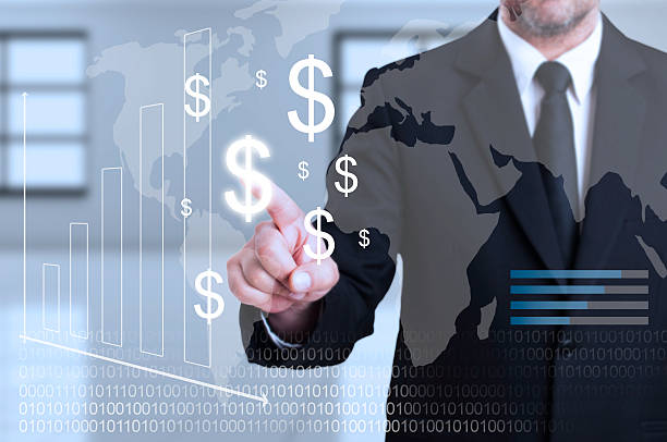 istock Businessman touching transparent digital screen as curency trans 520875314