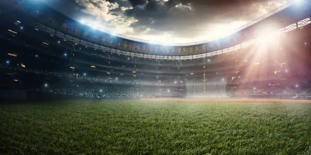 A wide angle of a outdoor baseball stadium full of spectators under a stormy night sky. The image has depth of field with the focus on the foreground part of the pitch. Stadium and all elements are made in 3D.