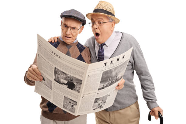 istock Two baffled senior men reading the news 520877896
