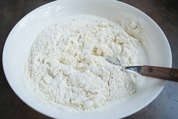 istock Dough for cheesecakes, spoon are in a white dish. 520878000