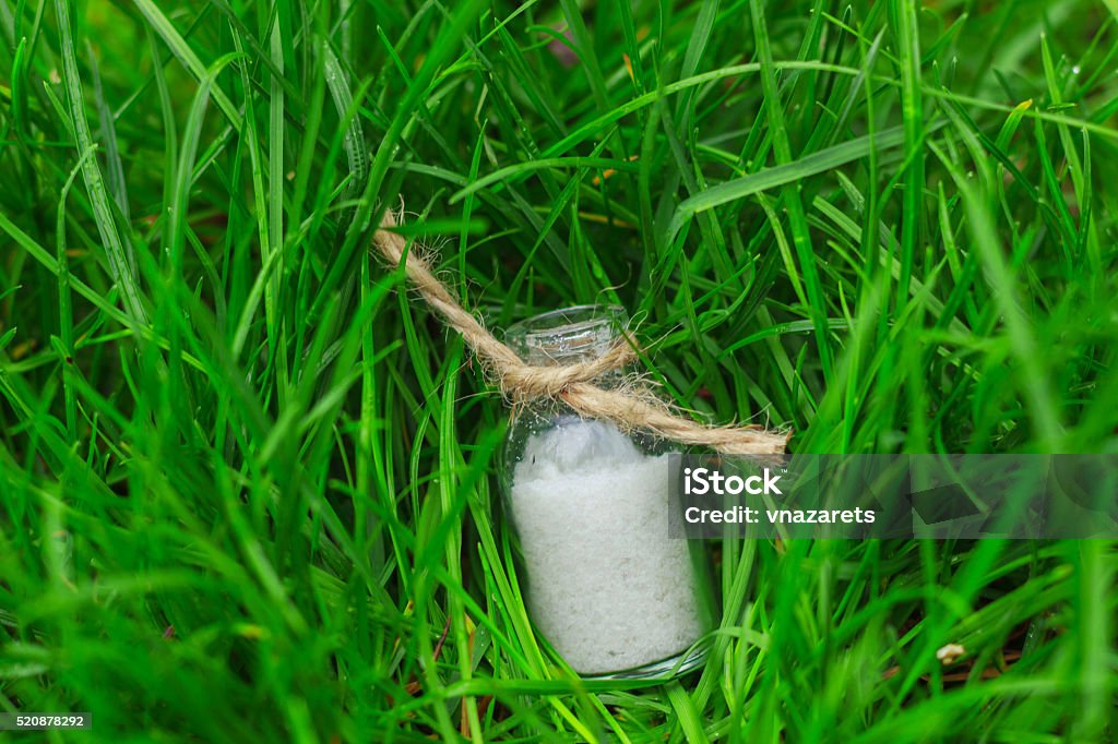 salt in a small jar on the grass Aromatherapy Stock Photo