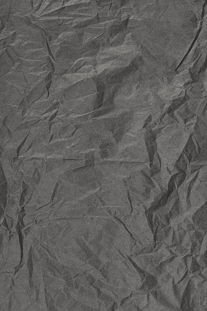 istock vertical background from black crumpled paper 520878588