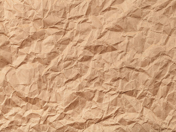 istock background from brown crumpled paper 520878964