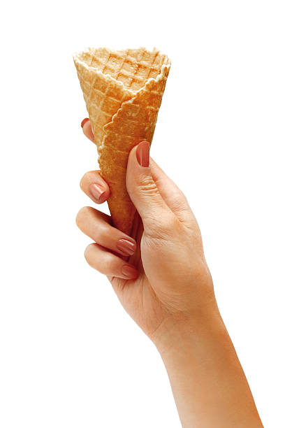 istock Female hand holding empty wafer cone for ice cream 520881992