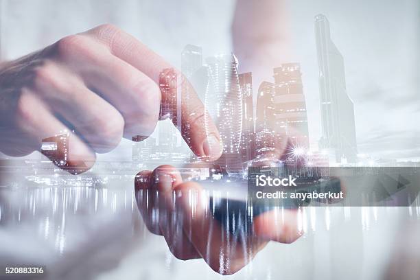Hands With Mobile Double Exposure Stock Photo - Download Image Now - City, Digital Display, World Map