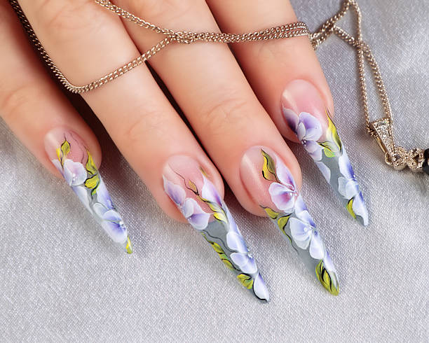 istock Female hand with manicure  and beautiful design on  nails. 520884647