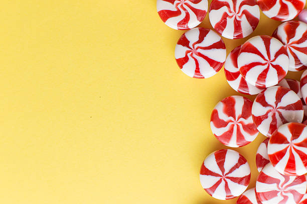 istock Candies colorful mix on yellow bright background with copy space 520884830