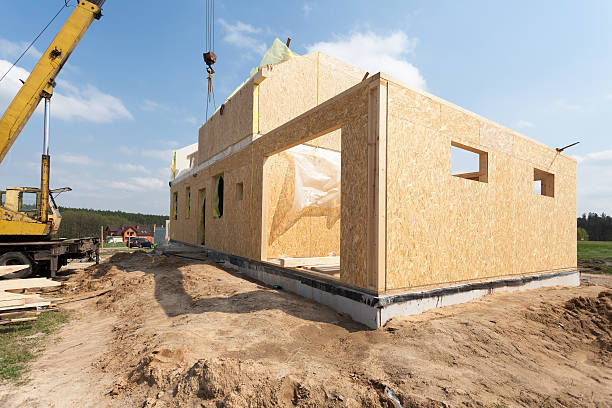 istock Frame house construction. View on new building with crane 520885284