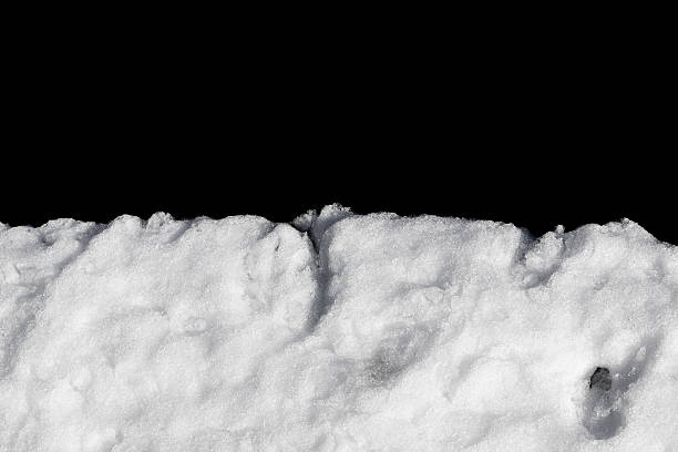 istock Pile of snow isolated on black 520885348