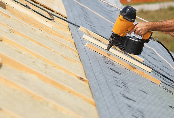 istock Building contractor worker (roofer) with air nail gun nailer working 520885608