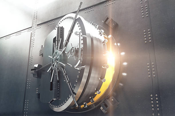 Closeup of bank vault door Closeup of an open bank vault door with golden light peeking from inside. 3D Render safe stock pictures, royalty-free photos & images