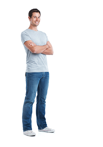 Full length portrait of a handsome man standing with his arms folded isolated on white