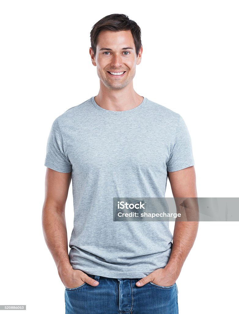 Feeling casual Cropped portrait of a handsome man standing with his hands in his pockets isolated on white T-Shirt Stock Photo