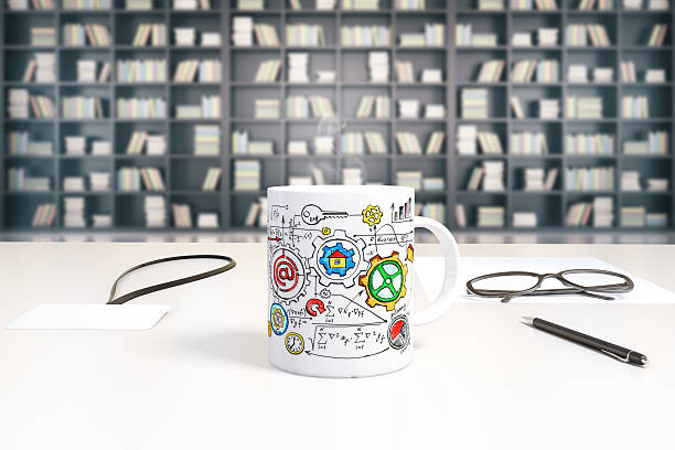 Cup with business scheme print on white table