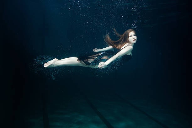 istock Woman swims underwater. 520886920