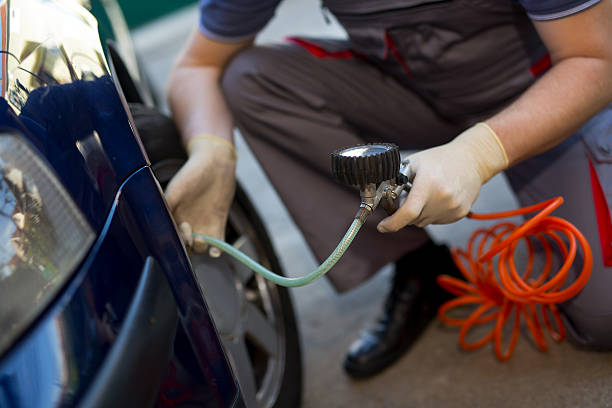 istock Mechanic repairman making tyre in workshop 520887496