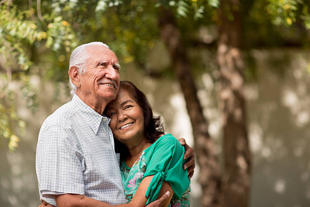 istock Senior latin couple holding each other 520888164