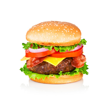 A Very Big and Tasty Cheeseburger with Beef, Bacon, Tomato, Lettuce, Onion on Sesame Seed Bun. Perfectly Styled and Retouched, Vibrant Colors. A Classic Fast Food Cheeseburger. Studio Isolated on White Backdrop with Shadow. Photo taken with Canon EOS 5D Mark II