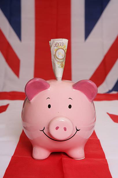 istock Saving ten pounds with piggybank 520888883