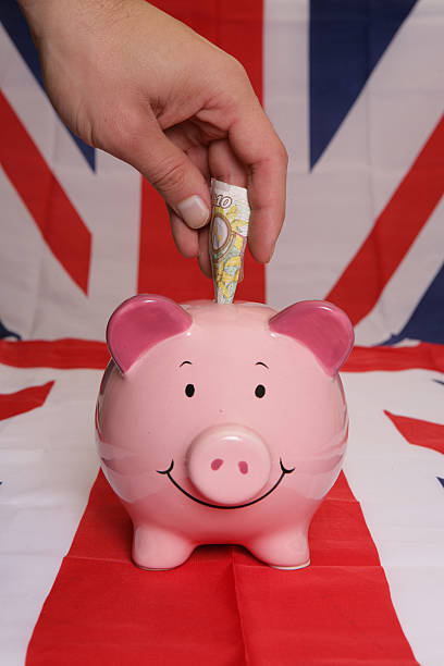 istock Saving ten pounds with piggybank 520889003