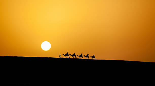 istock Caravan in the desert during sunset 520889445