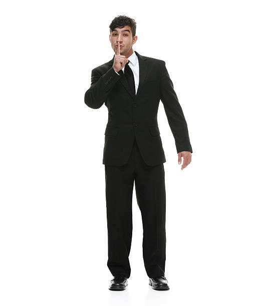 istock Businessman doing the be quiet sign 520889946