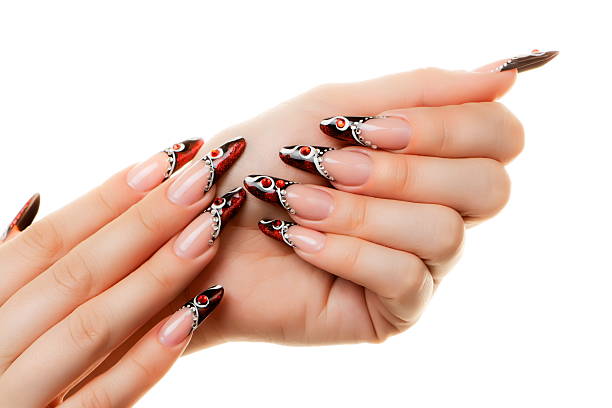 istock Female hand with manicure  and beautiful design on  nails. 520889987