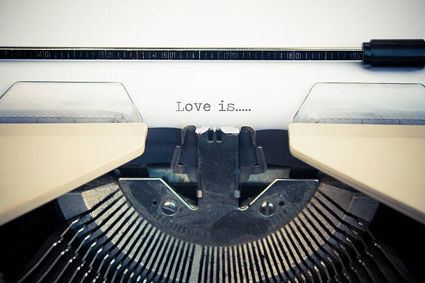 istock typewriter with white paper. Love is sign 520890268